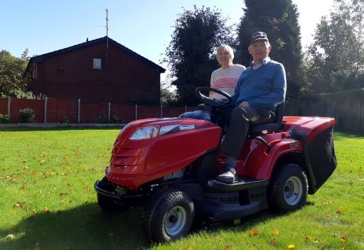 Roy & Marjorie on their new ride-on mower 